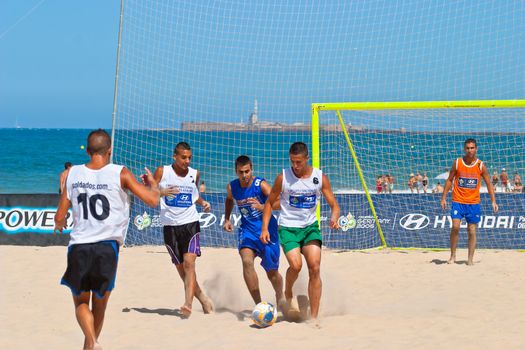 CADIZ, SPAIN -  JUL 22:  Unknown players of unknown team playing the Spanish Championship of Beach Soccer on Jul 22, 2006 on the beach of La Victoria in Cadiz, Spain