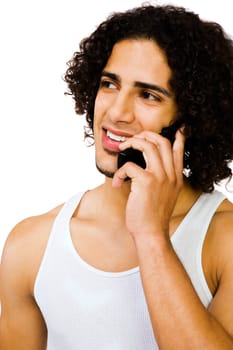 Man talking on a mobile phone and smiling isolated over white
