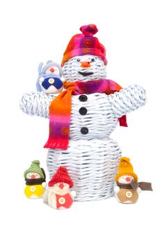 Great knitted snowman made from paper and other smaller snowmen around like children.