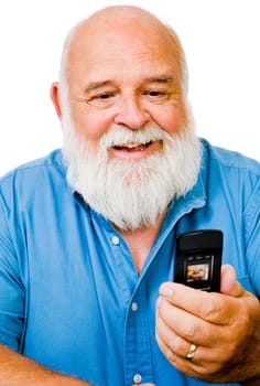 Confident man text messaging on a mobile phone isolated over white