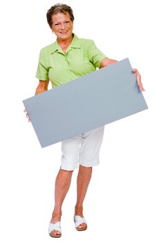 Portrait of a woman showing a placard and smiling isolated over white