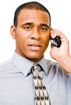 Serious businessman talking on a mobile phone isolated over white