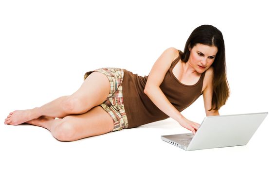 Fashion model using a laptop isolated over white