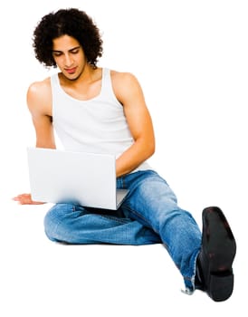 Man using a laptop and posing isolated over white