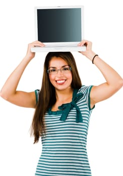 Smiling woman holding a laptop isolated over white