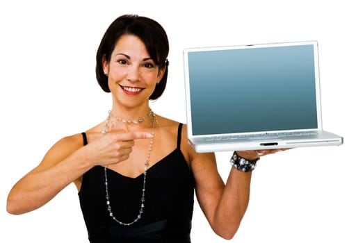 Smiling woman pointing towards a laptop isolated over white