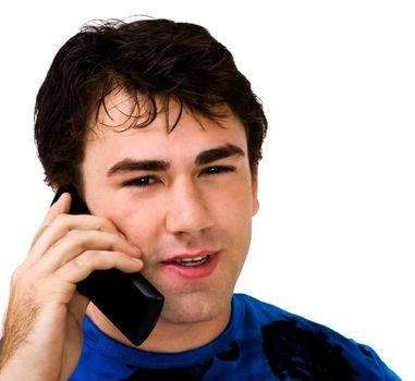 Man talking on a mobile phone and smiling isolated over white