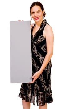 Smiling woman showing an empty placard isolated over white