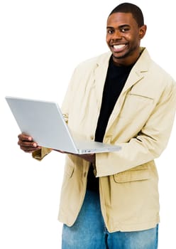 Happy man using a laptop and posing isolated over white