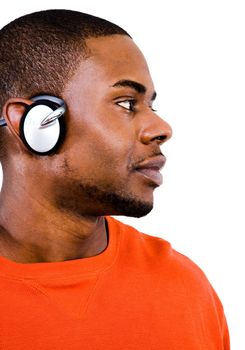 Man wearing headphones and listening to music isolated over white