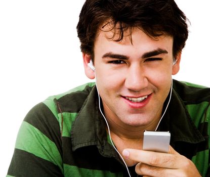 Portrait of a man listening to music on a MP3 player isolated over white