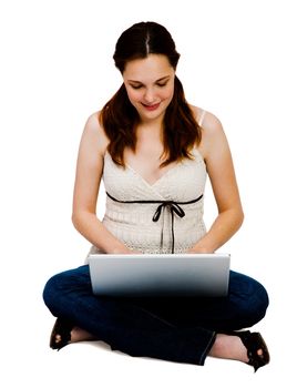 Woman using a laptop and smiling isolated over white