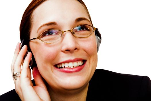 Young businesswoman listening to music on a headphones isolated over white