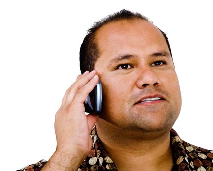 Man talking on a mobile phone and posing isolated over white