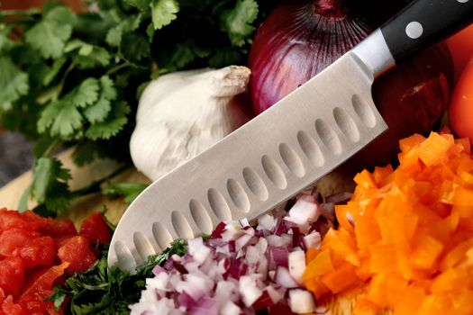 a knife and freshly chopped ingredients