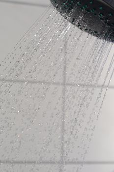 water drops falling from a shower indoors