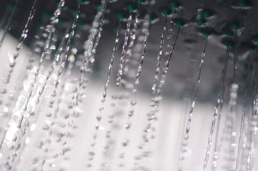 water drops falling from a shower indoors