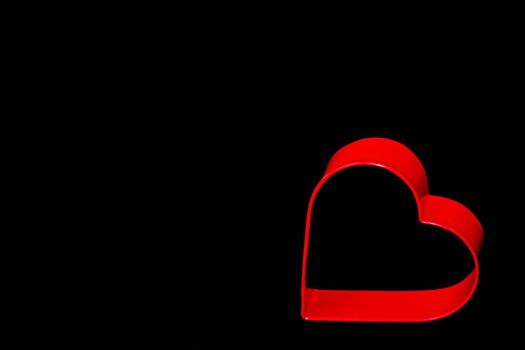 a red heart on a black background