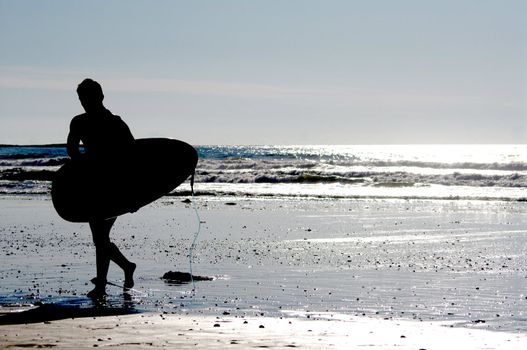 surfing at a nice beach outside at the sea