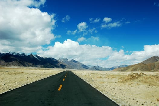 Landscape of a highway road extending to the distance