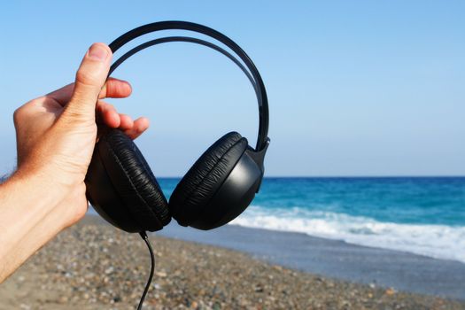 blue and black headphones over a white background