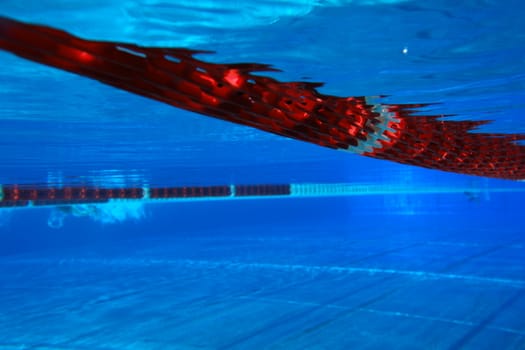 underwater view from a swimming pool with red marking