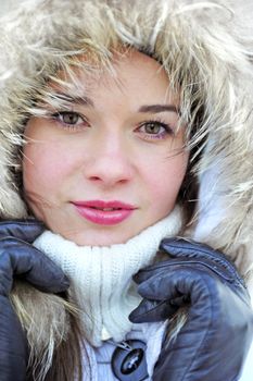 young girl in warm clothes ? close-up