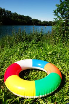 swim ring floating on beautiful blue lake