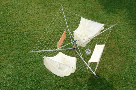 Close-up of a drying rack outside meadow