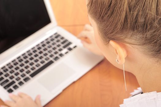 businesswoman in office with laptop