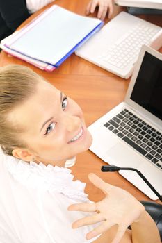  young businesswoman in office with laptop
