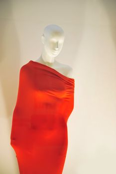 mannequin wrapped in red material