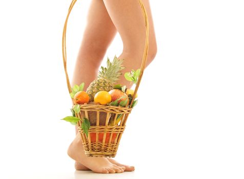 girl with a basket of fruit isolated on white