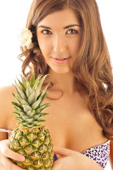  young sexy smiling girl with pine-apple isolated on white and symbolizing summer