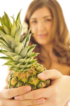  young smiling girl with pine-apple isolated on white