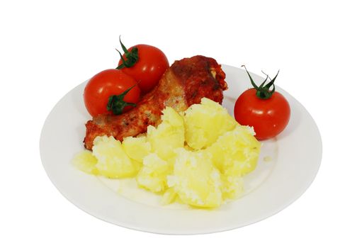 a natural typical peasant food with potato, tomatoes and chicken