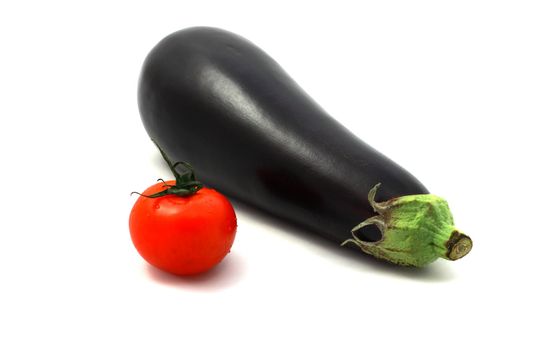 fresh juicy eggplant and tomato on white background
