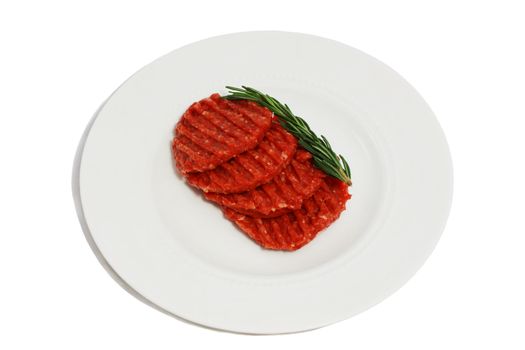 raw meat for barbecue with rosemary on the white plate isolated