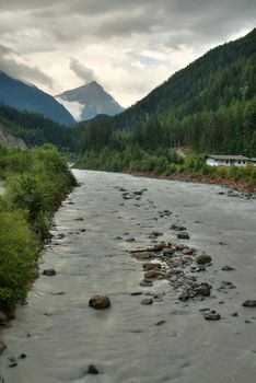 Fast mountain stream in a valley