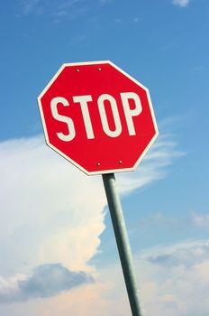 Stop traffic sign against clear blue sky