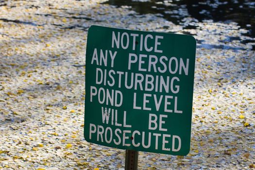 Do not disturb pond level warning sign.