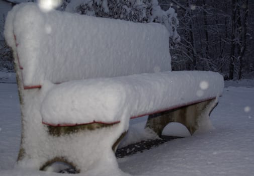 snowy park bench