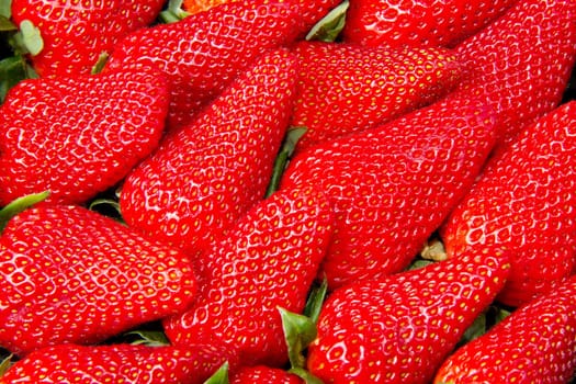 Red juicy strawberries closeup, background 
