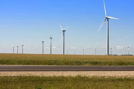 Modern Windmills generating electricity along the Interstate.