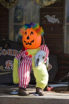 A Jack-o'-Lantern sits quietly on the Porch.