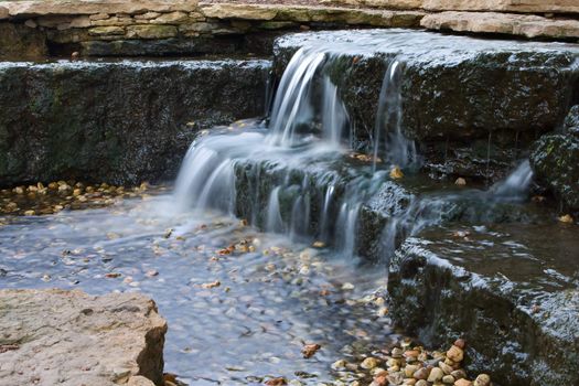 Long exposure of a beautiful cascading waterfall in the spring time.