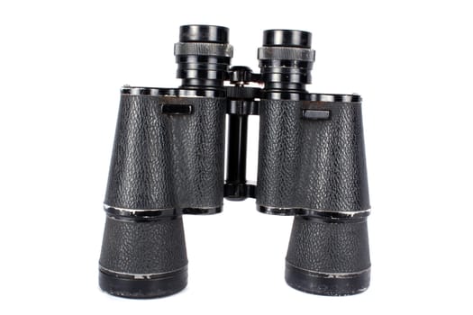 A pair of old binoculars, isolated on white studio background.