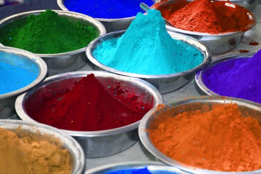 Colorful powder in bowls for the celebration of holi festival, in India.