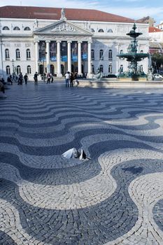 Lisbon's downtown main square with National theatre on the back