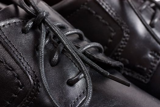 Macro view of men black shoes and black laces